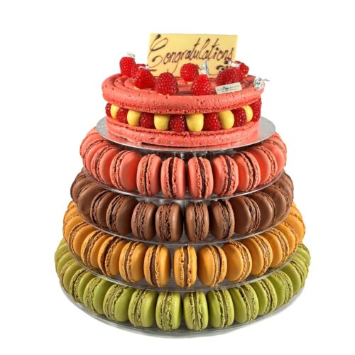 Lower tiers macaron tower with handmade French macarons and celebration cake by Florian Poirot, perfect for weddings and special occasions.