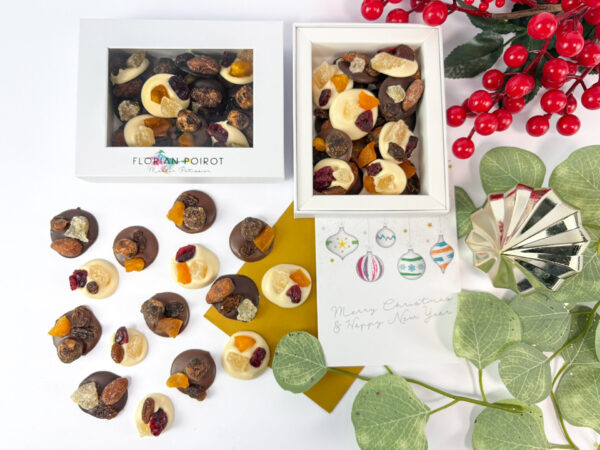 Christmas chocolate mendiant gift box with milk, dark and white chocolate and festive toppings