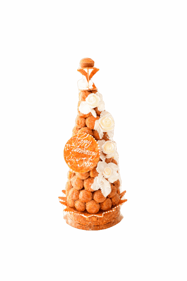 Elegant French Croquembouche wedding cake with caramel-glazed choux and bespoke sugar work by Florian Poirot